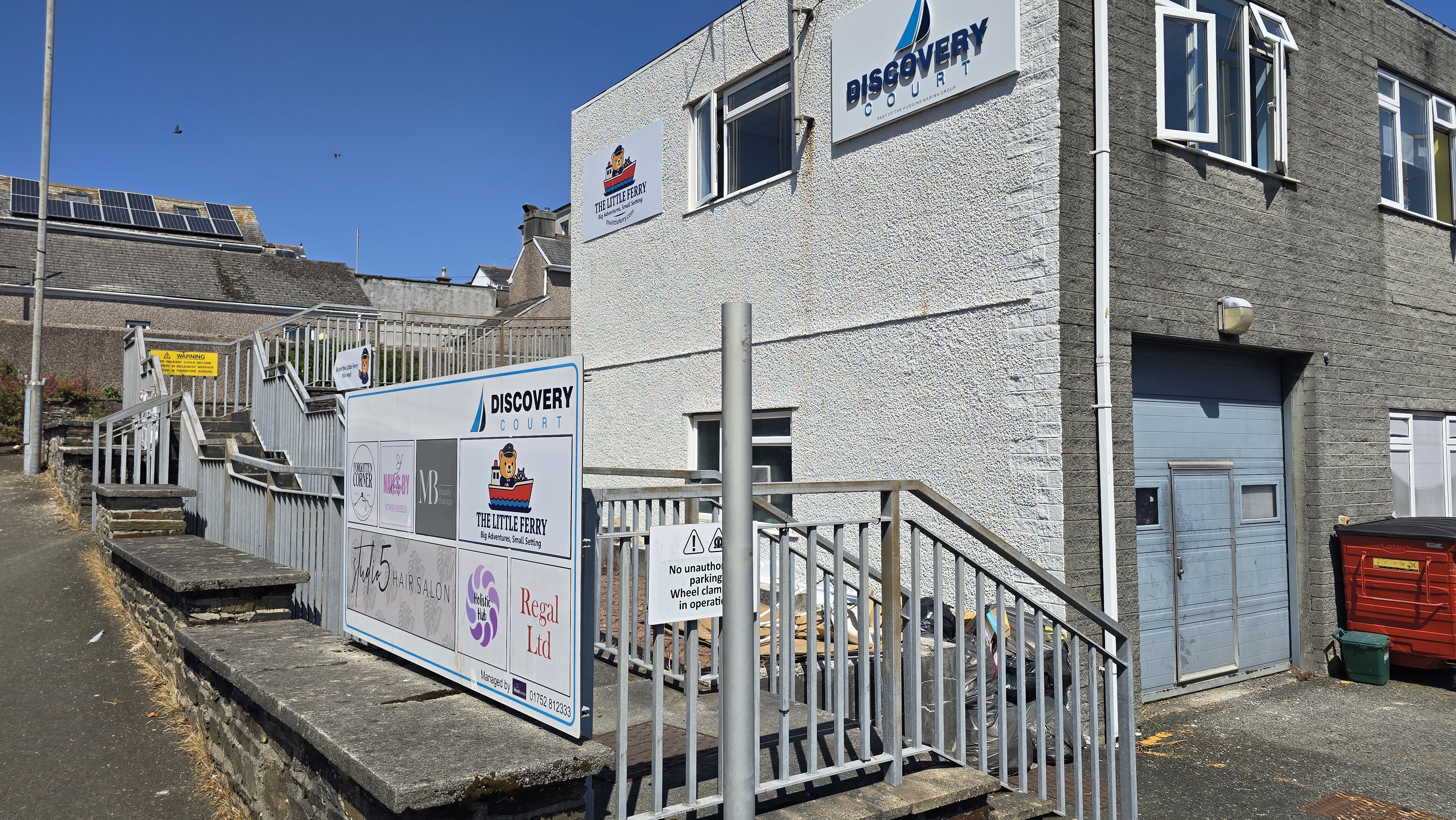 Walkway ramp and stairs leading up to venue entrance